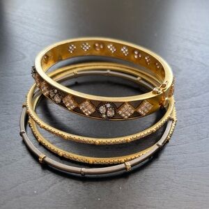 Alexis Bittar gold and gunmetal stack of bangles